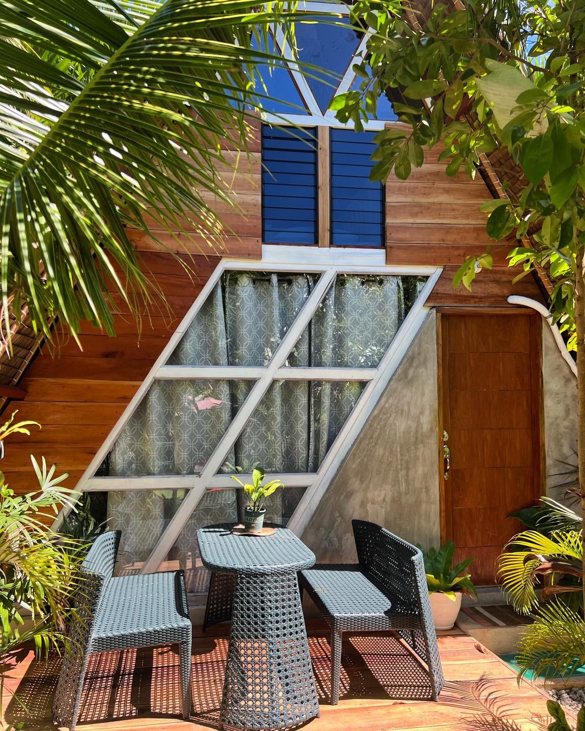 Private patio seating outside an A-frame cottage
