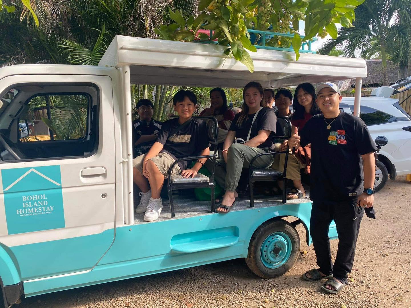 Guests riding in the Bohol Island Homestay tour vehicle