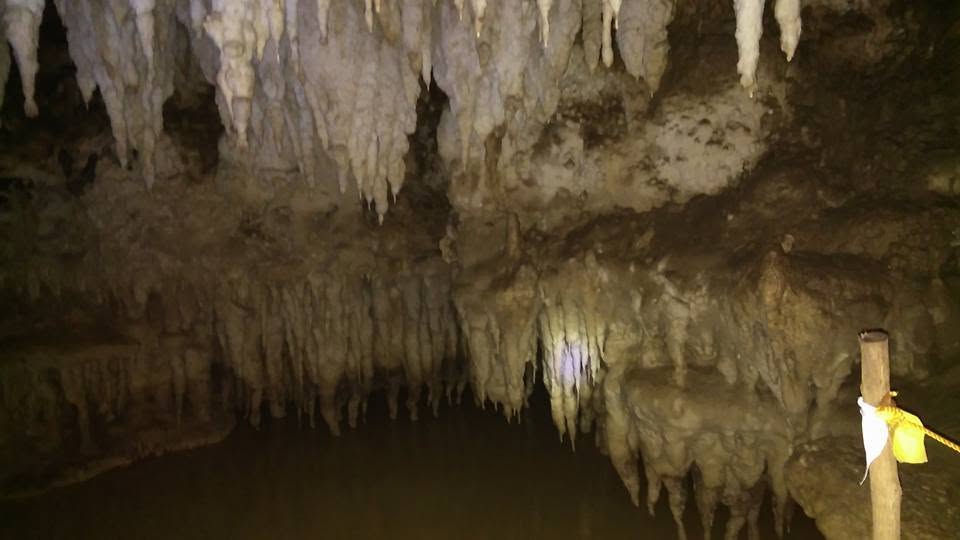 Limestone stalactite formations inside a nearby cave