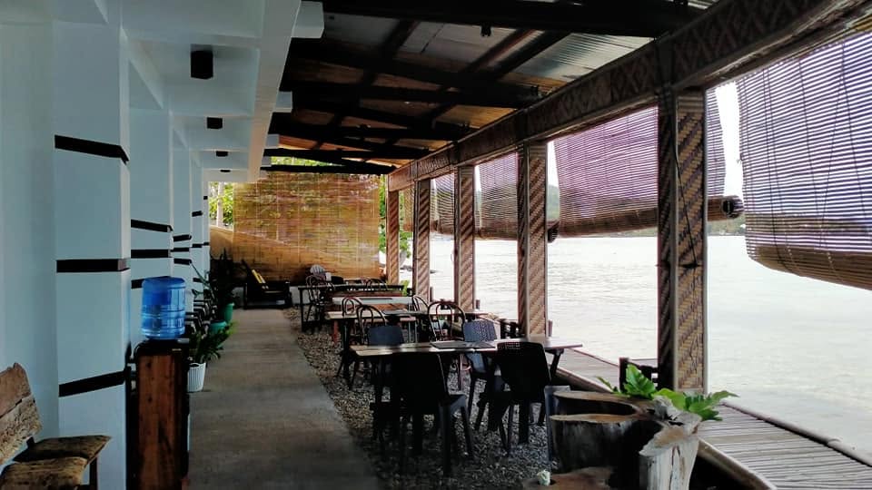 Tables and seating along JD's covered waterfront deck