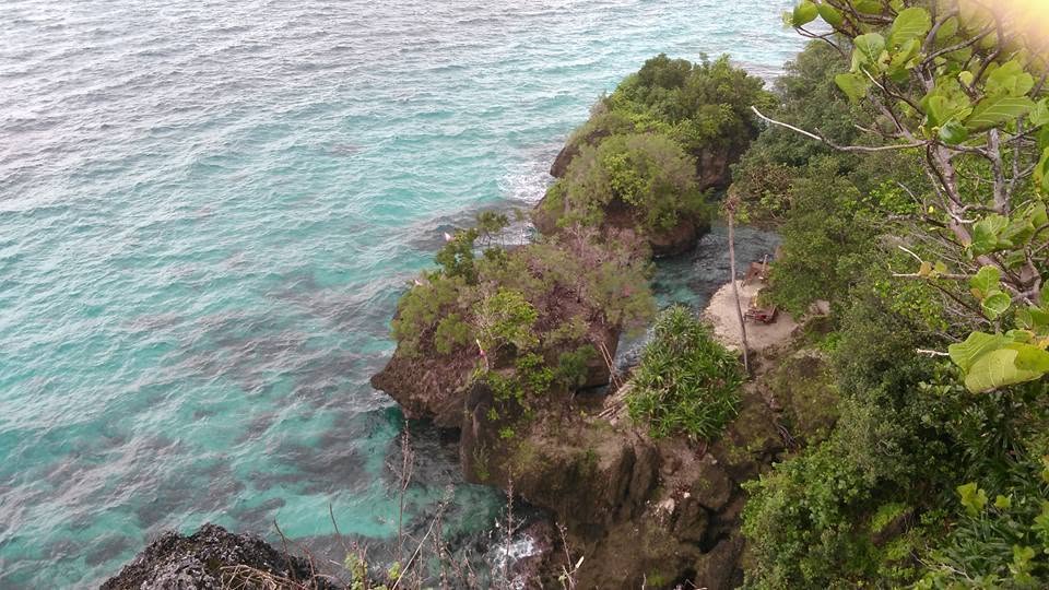 Clear turquoise water along a limestone shoreline