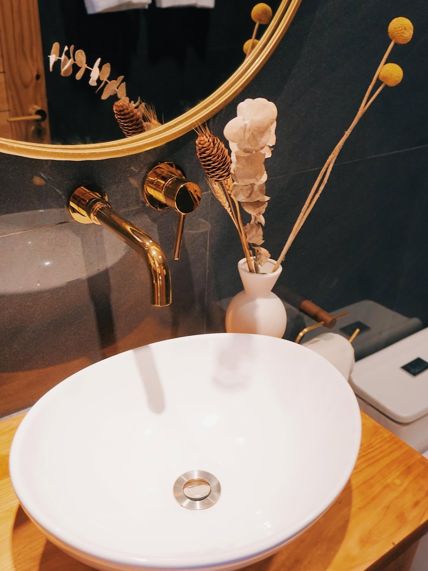 Ensuite bathroom with a vessel sink and brass tapware
