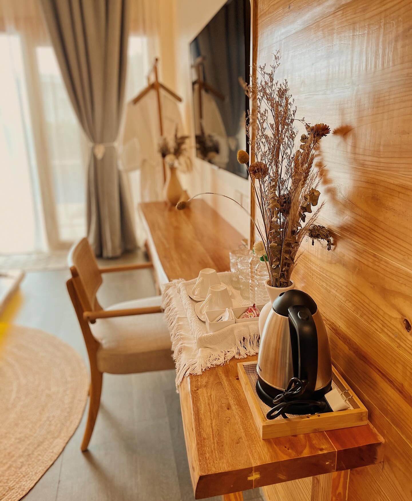 Timber desk with dried flowers and a tea tray
