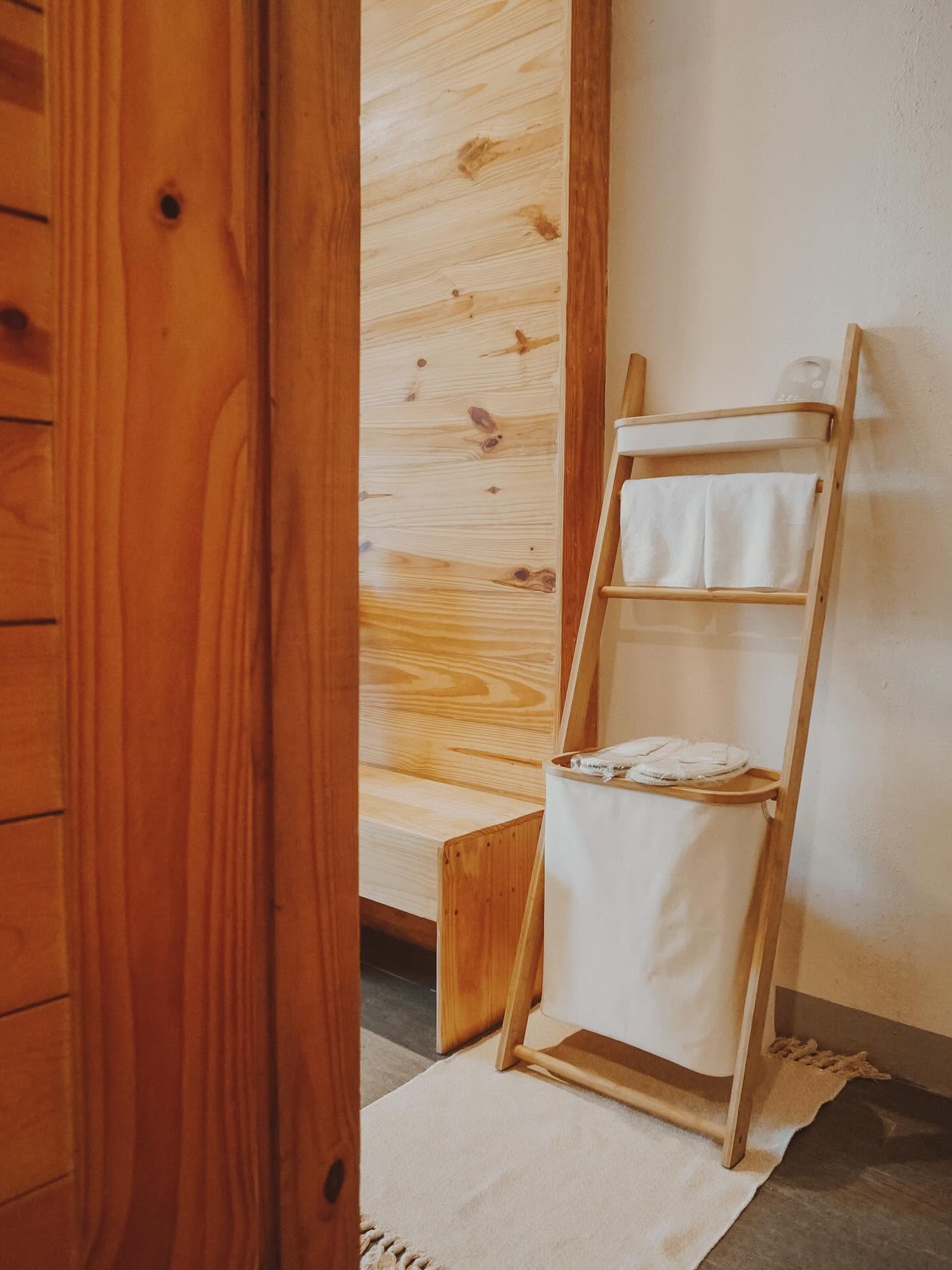 Timber wardrobe with a towel ladder alongside