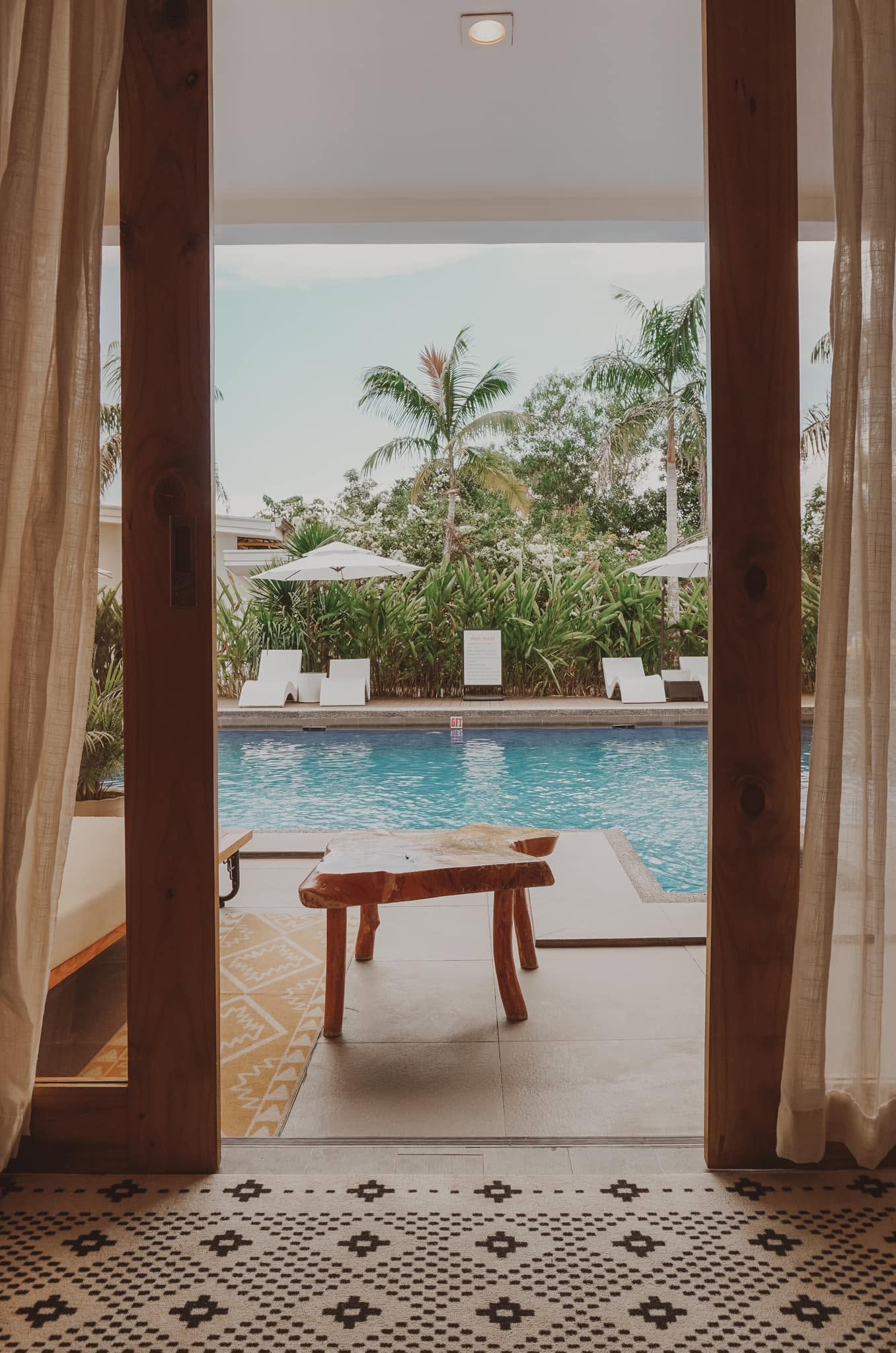 Wide view of the outdoor pool and resort building