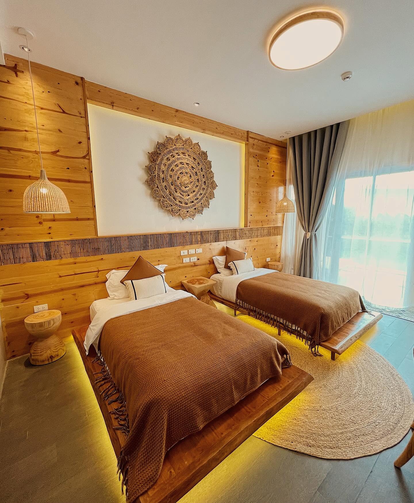 Twin room with woven mandala wall art